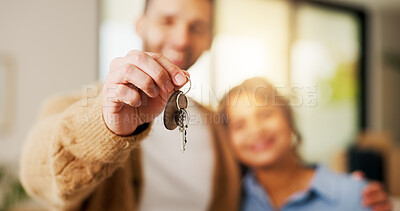 Buy stock photo Property, couple and hand in home with key, fresh start and investment in dream house. Real estate, man and woman with milestone together, housing success or moving achievement for new homeowners.
