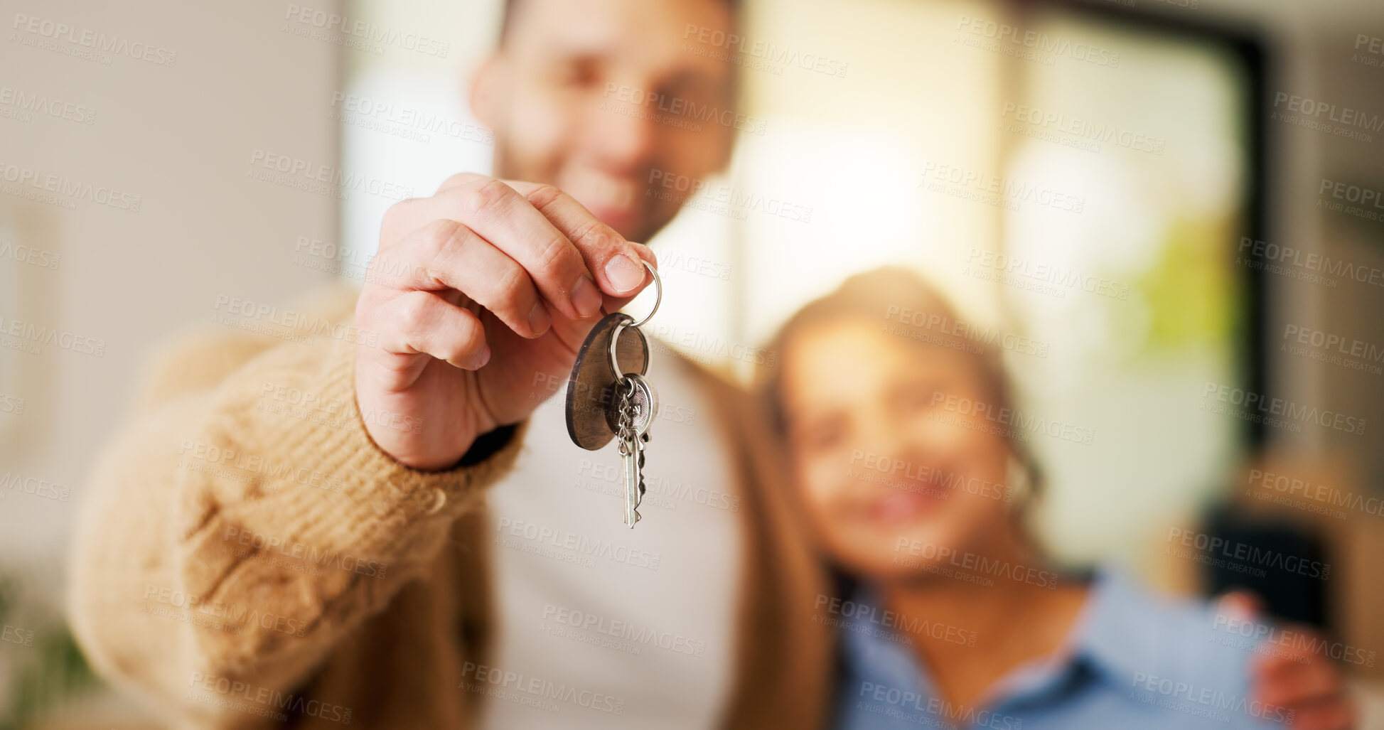 Buy stock photo Property, couple and hand in home with key, fresh start and investment in dream house. Real estate, man and woman with milestone together, housing success or moving achievement for new homeowners.