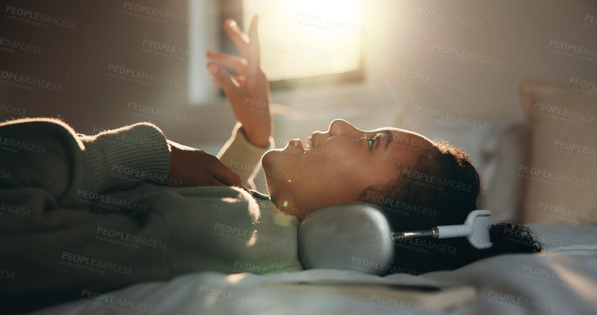 Buy stock photo Child, headphones and sing with girl on bed in home for audio listening or morning streaming. Flare, melody and music with happy kid in bedroom of apartment for playlist or sound subscription