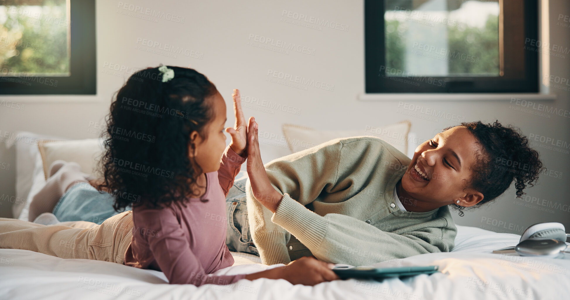 Buy stock photo High five, smile and tablet with children on bed in home for holiday, morning break or weekend. App, sister and success with happy girls in bedroom of apartment for development, future or growth