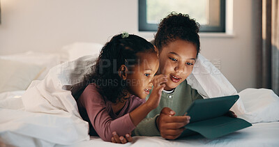 Buy stock photo Relax, children and girls with tablet in bed, watch cartoon and streaming video for weekend bonding. Family subscription, movie website or sisters with tech for film platform, smile or rest in home