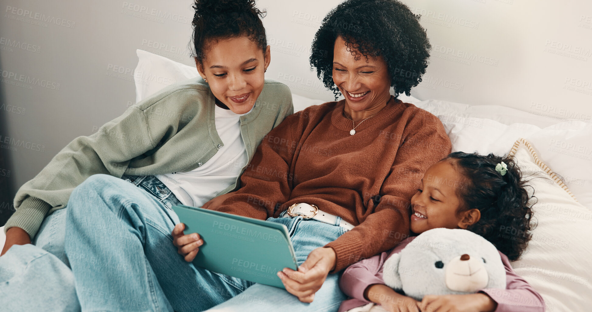 Buy stock photo Relax, mother and children with tablet on bed, watch family movie and smile for weekend streaming. Film subscription, happy woman and girls with teddy bear for bonding, tech and reading ebook in home
