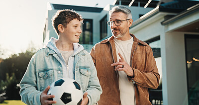 Buy stock photo Soccer, talking and father with son outdoor for bonding, support and teaching game. Football, connection and weekend break with man and child in backyard of family home for growth, advice and care