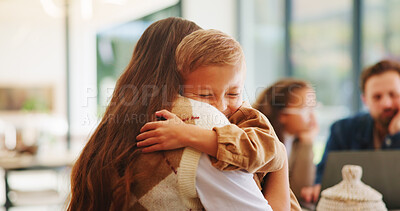Buy stock photo Mother, son and hug in home with family connection, bonding together and support for child development. Happy, mom and young boy in living room with embrace, wellness and parent care on weekend.