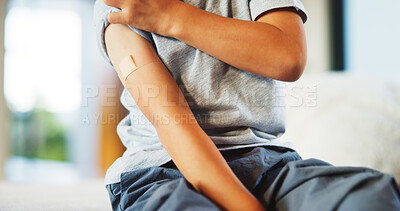 Buy stock photo Child, plaster and arm for healthcare or wellness with immunization, vaccine or first aid care. Bandage, healing and girl on bed for flu shot, immunity and medicine for health or development