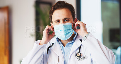 Buy stock photo Face mask, healthcare and portrait of doctor in hospital for disease control or infection protection. Cover, medical and safety with man in professional clinic for compliance, medicine or wellness