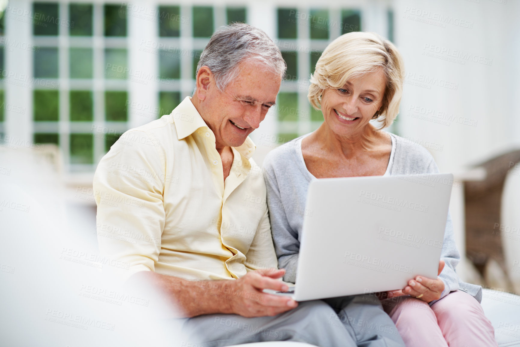 Buy stock photo Laptop, smile and search with old couple on sofa for retirement trip, bucket list destination or love. Travel itinerary, senior vacation or online with elderly man and woman in living room in home
