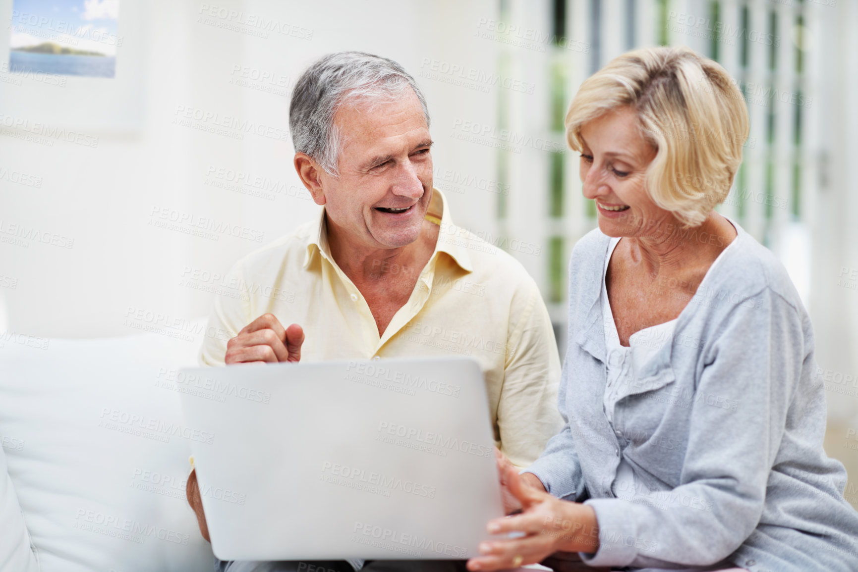 Buy stock photo Laptop, happy and search with old couple on sofa for retirement trip, bucket list destination or love. Travel itinerary, senior vacation or online with elderly man and woman in living room in home