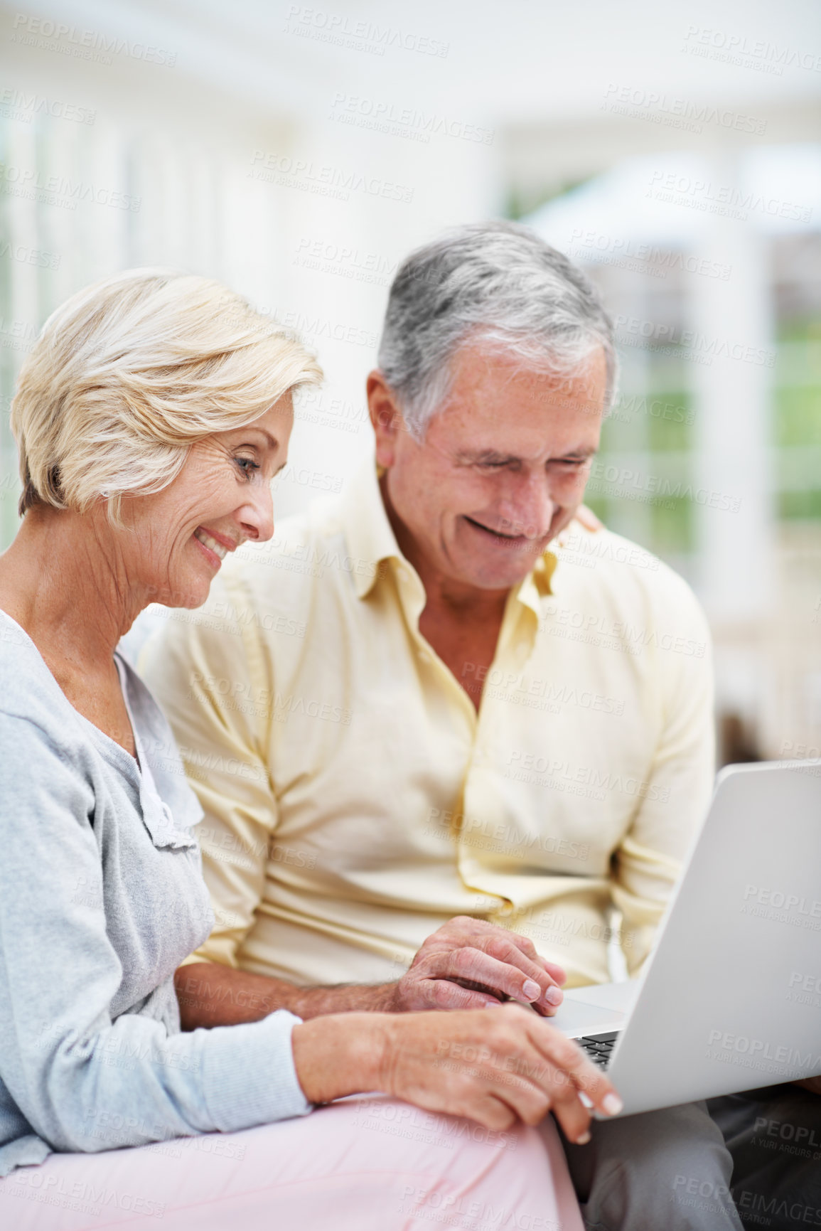 Buy stock photo Laptop, planning and reading with old couple on sofa for retirement trip, bucket list search or love. Travel itinerary, senior vacation or online with elderly man and woman in living room in home