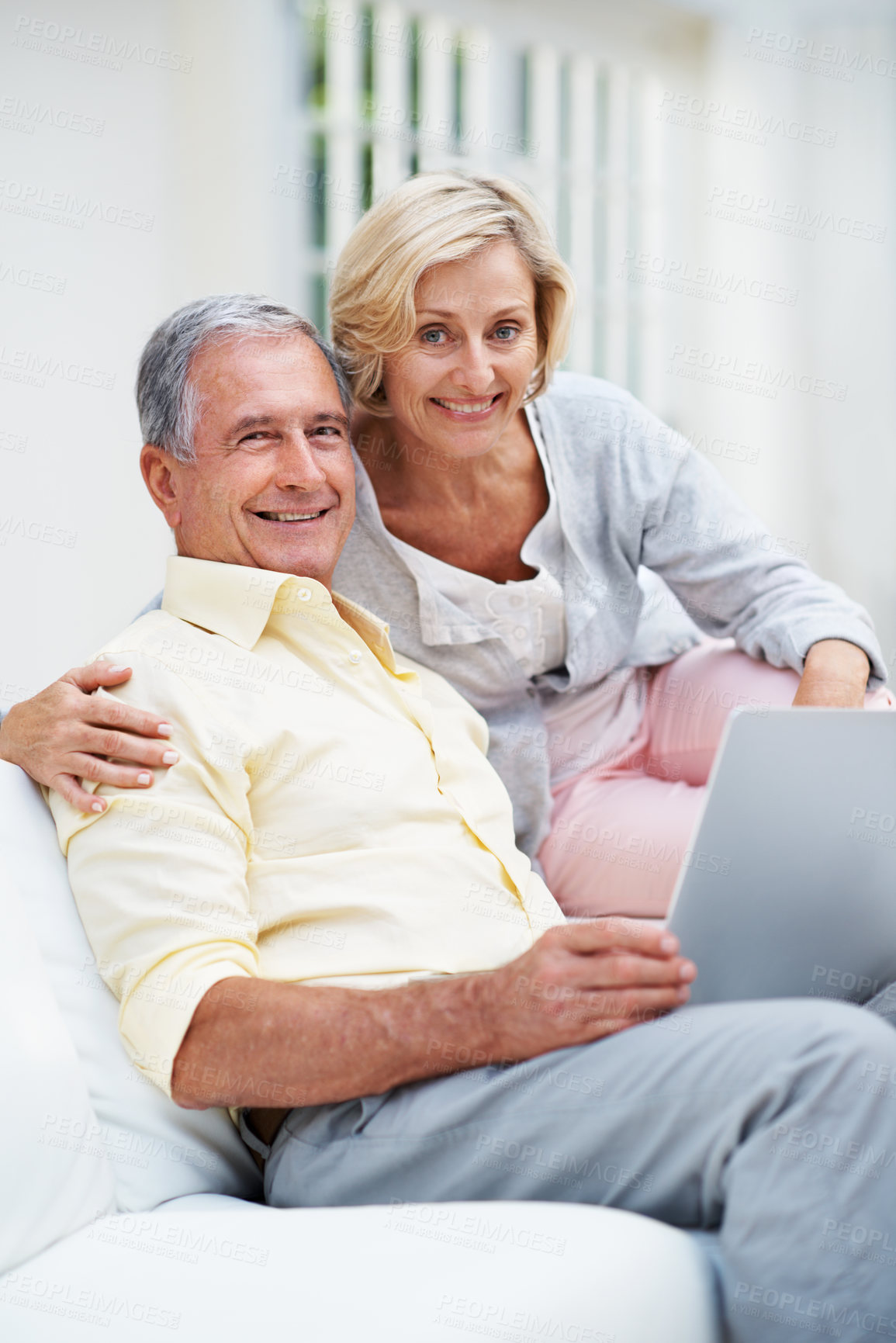 Buy stock photo Senior, couple and portrait with laptop in home for pension research, verify eligibility and bonding. Love, hug and happy people with tech on sofa for digital finance, retirement planning and support