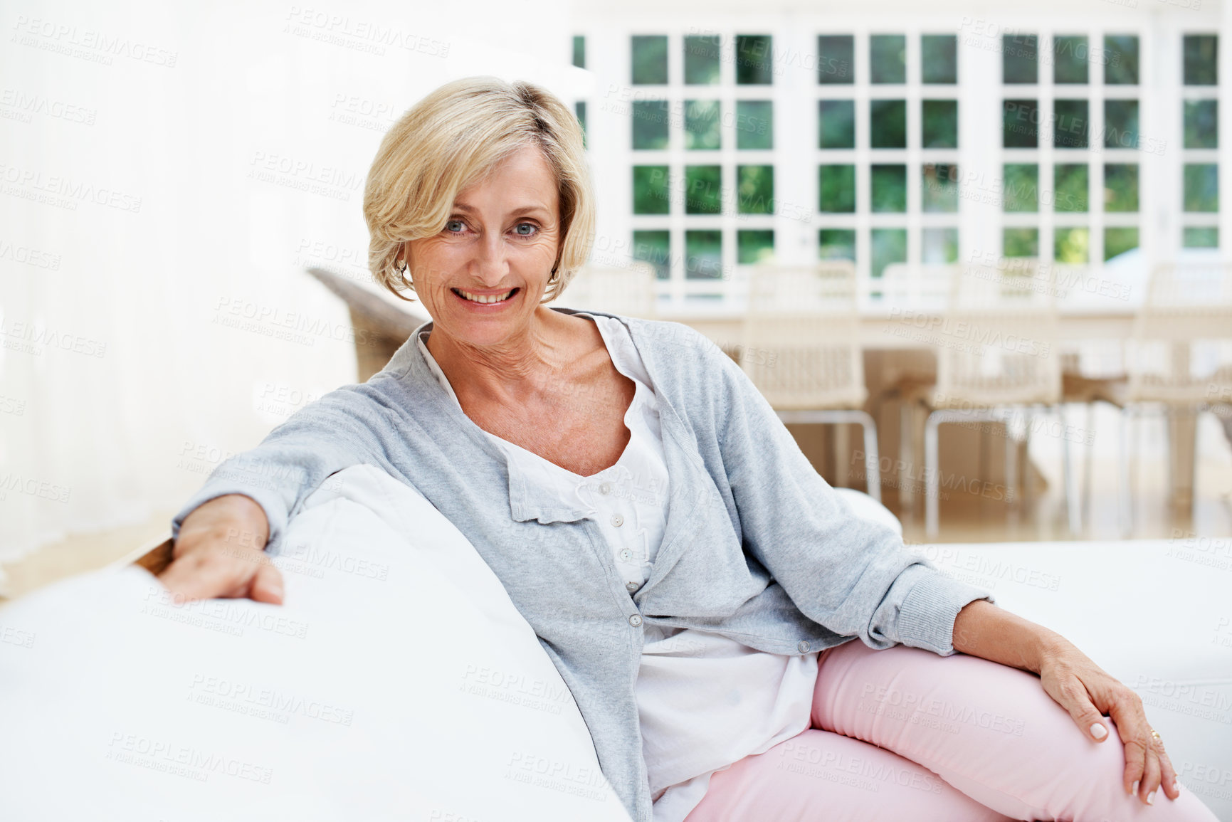 Buy stock photo Happy, relax and portrait of old woman on sofa in home for weekend break, pride and wellness. Confidence, retirement and smile with senior person in living room in apartment for satisfaction and calm