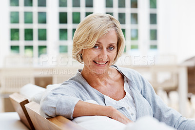 Buy stock photo An attractive senior woman relaxing at home 