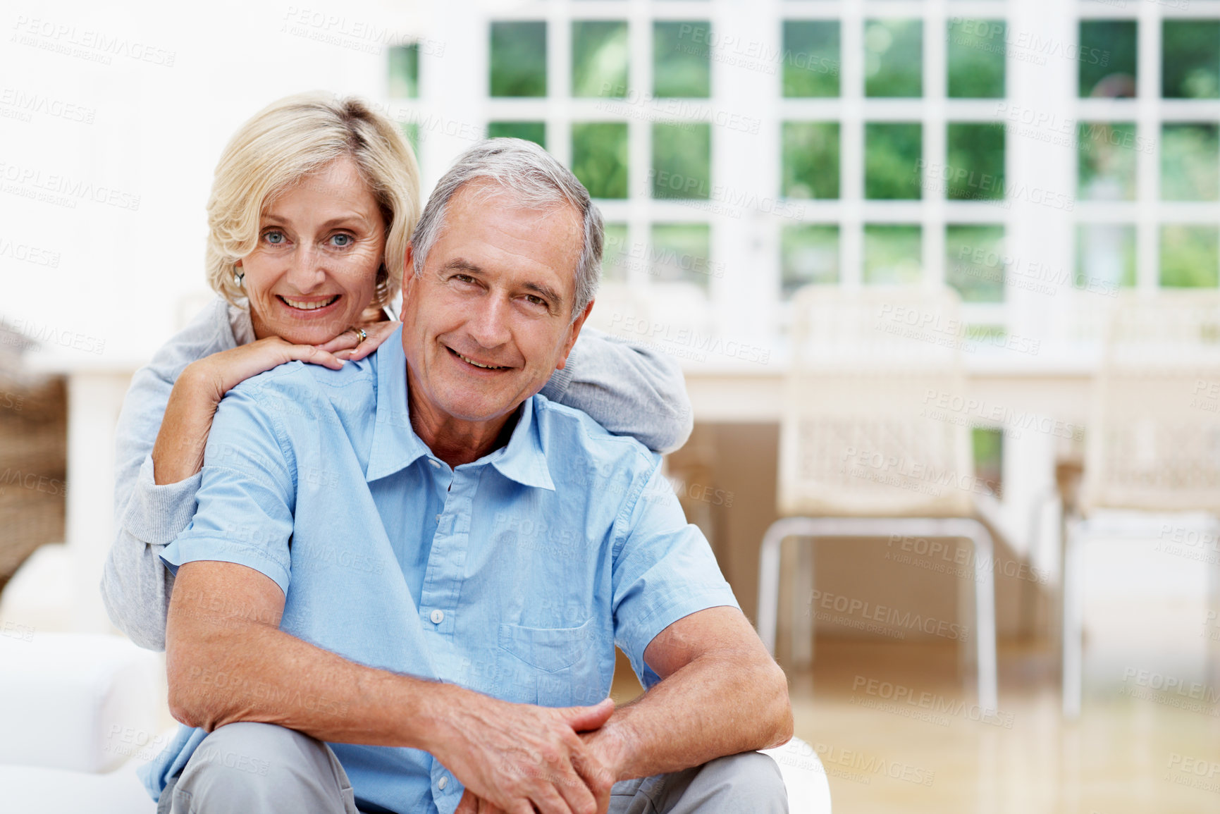 Buy stock photo Happy, old couple and relax at house with portrait, love and support for bonding together in lounge. Smile, senior people and rest in home with trust, partner affection and retirement for commitment