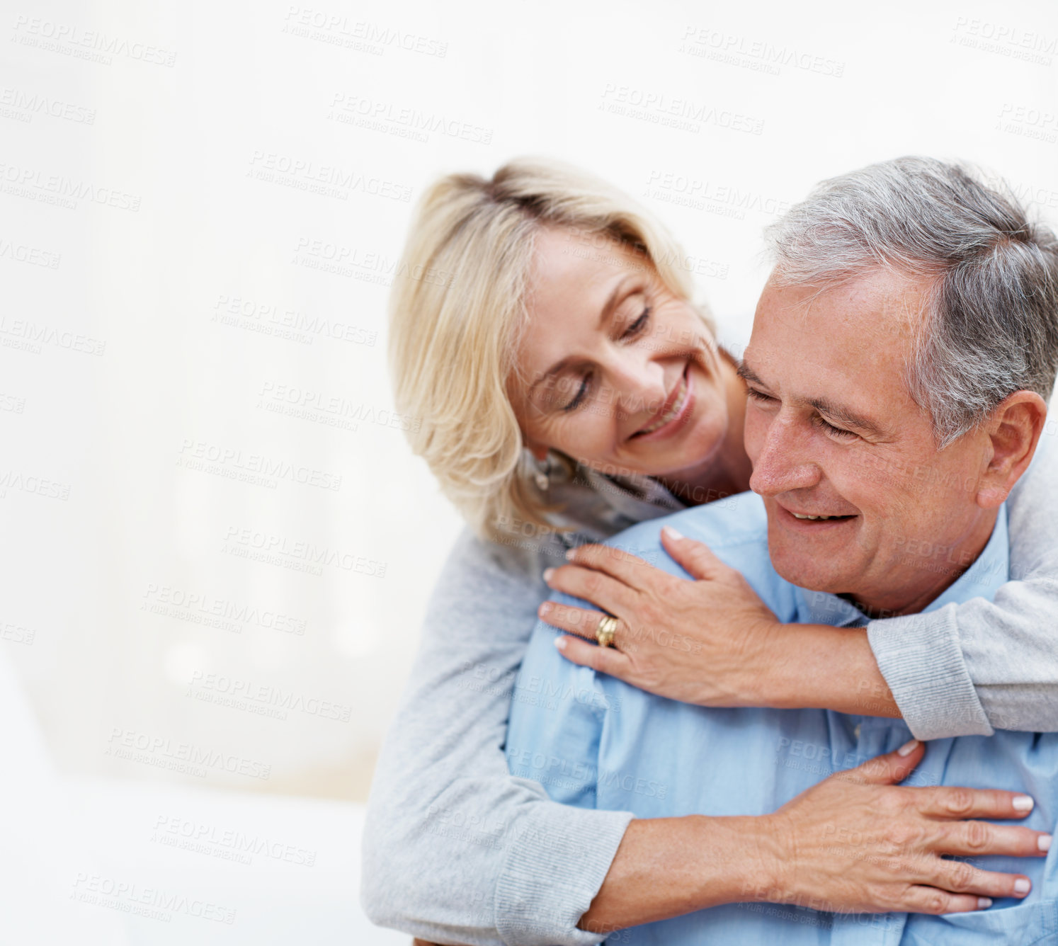 Buy stock photo Hug, smile and space with old couple in home for bonding, romantic connection and marriage. Retirement, trust and support with senior man and woman in living room in apartment for love and care