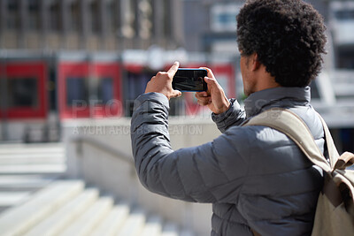 Buy stock photo Travel, photo and man in city, phone to capture memory and summer holiday for break. Outdoor, mobile user and person with social media, post update and vacation with live streaming and internet