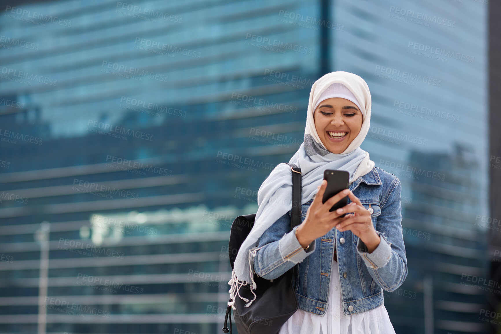Buy stock photo City, student and Muslim woman with phone for commute, reading message and university app for schedule. Laughing, mobile and happy scholar with hijab for morning travel, internet joke and space