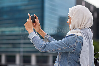 Buy stock photo Muslim woman, phone and photography in city, travel or capture memory for vacation adventure outdoor. Islamic person, mobile or picture in town for sightseeing, social media or smile for holiday post