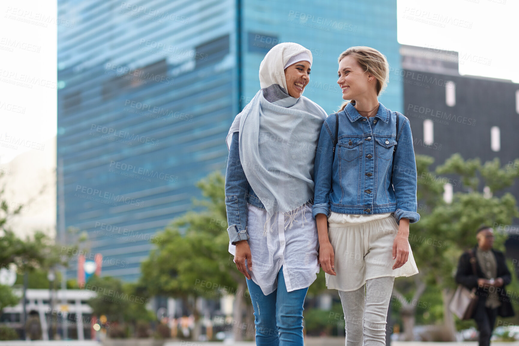 Buy stock photo College, friends and women walk in city with smile, bonding together and travel to campus in morning. Happy, exchange student and people downtown with connection, journey and commute to university.
