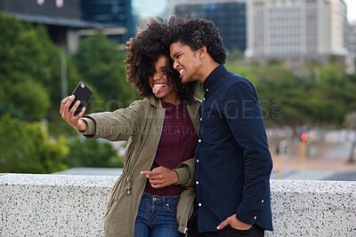 Buy stock photo African couple, selfie and smile in city for vacation, holiday adventure and tourism with photography. Happy, man and woman with tongue out, profile picture and together on honeymoon trip for bonding