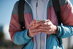 Close up hands using smartphone texting with mobile phone sharing messages unrecognizable person