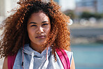 Portrait of beautiful woman with afro hairstyle on waterfront stylish urban female summertime fashion