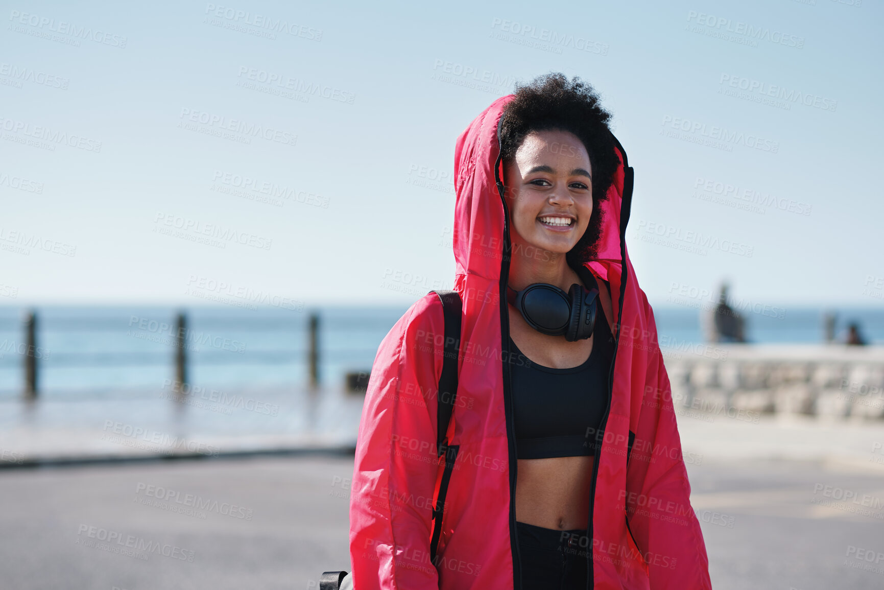 Buy stock photo Teenager, girl and portrait with fitness on promenade, gym gear or equipment with smile for sports practice. African athlete, child and sportswear with training, happy and headphones outdoor