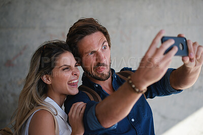 Buy stock photo Outdoor, travel or couple with funny face for selfie, holiday memory or internet post for trip update. Photography, playful or happy people with picture for social media, vacation or silly expression