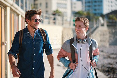 Buy stock photo Men, friends and walk in city with laugh for funny joke, bonding together and wellness on weekend break. Happy, people and hangout outdoor in urban town with bag, connection and humor for good mood.