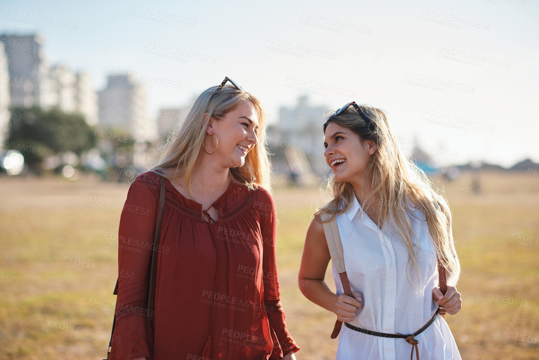 Buy stock photo Women, friends and walk in park with smile, bonding together or good mood for wellness on weekend break. Summer, happy people and hangout outdoor with travel, connection and stress free for holiday.