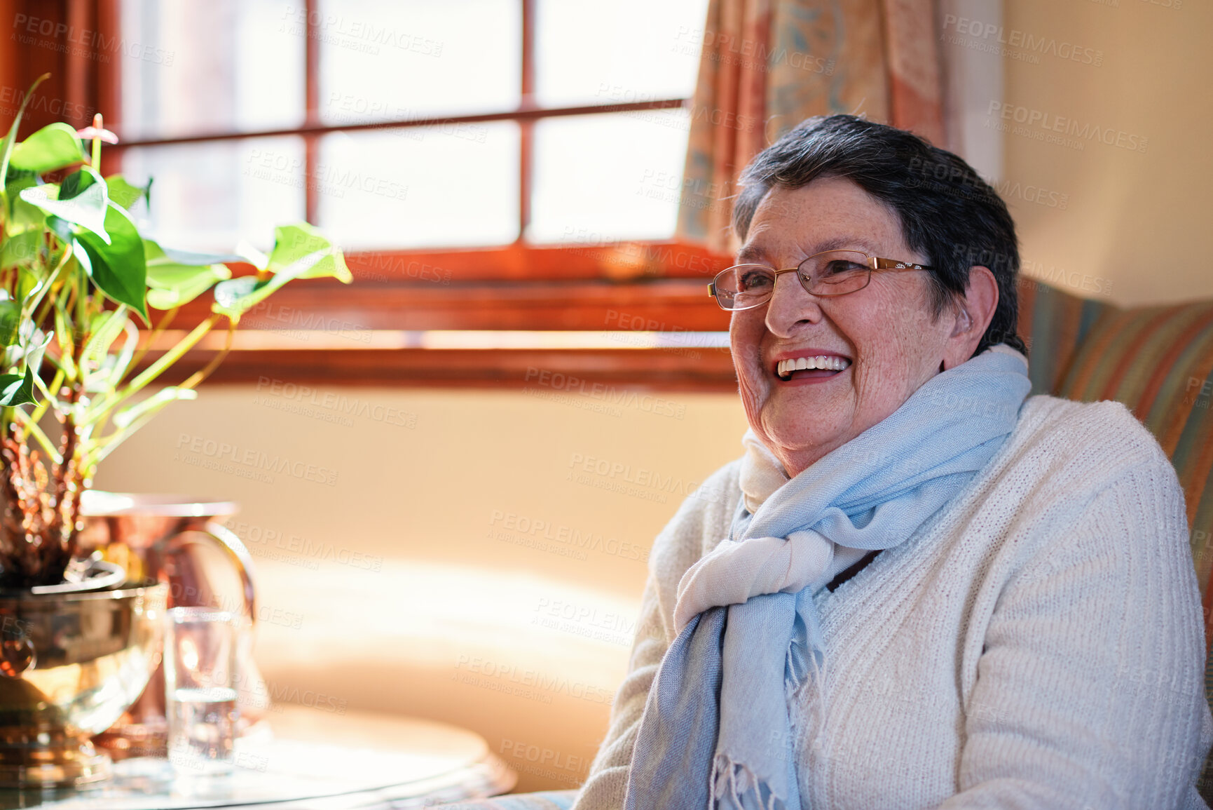 Buy stock photo Senior woman, smile and thinking on sofa with happy memory, laughing and nostalgia in living room. Retirement, elderly person and positive attitude in home for reflection, relax and humor on couch
