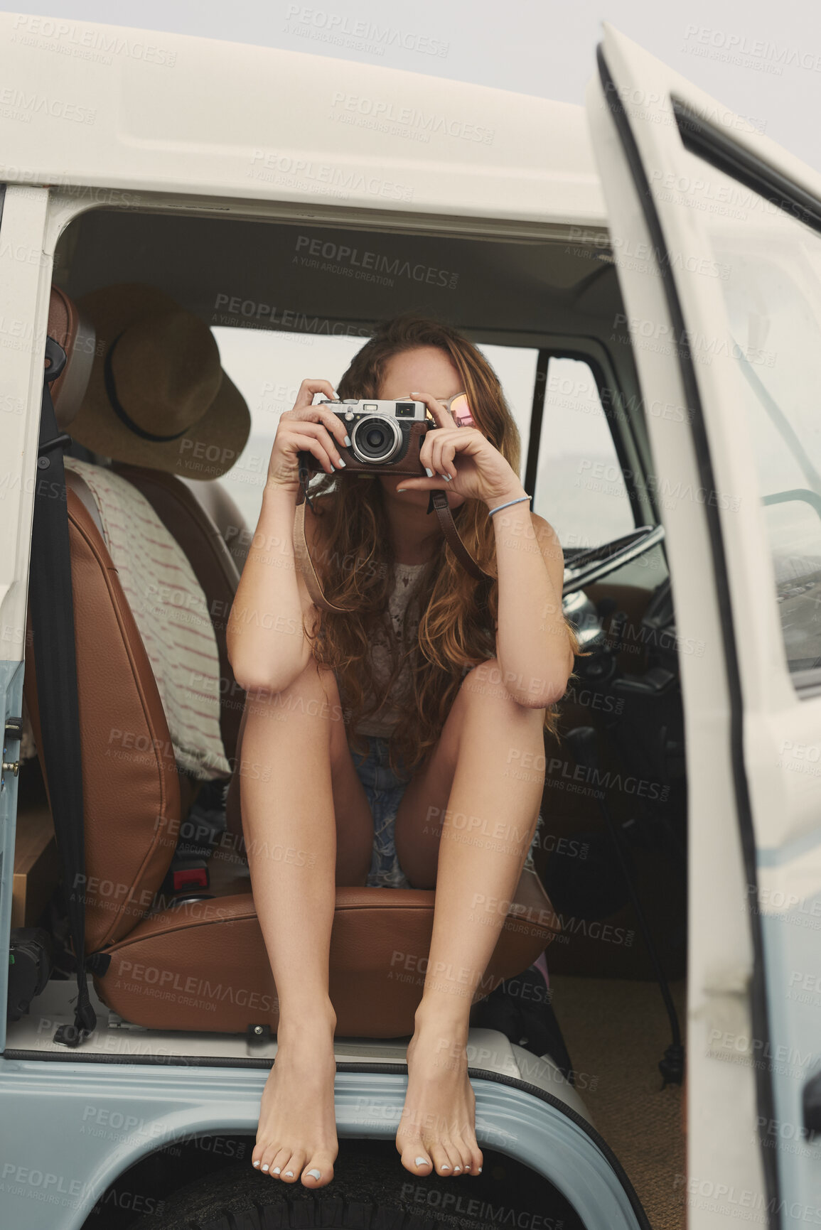 Buy stock photo Travel, camera and woman in camper van for memories on road trip, adventure and vacation in nature. Photography, sightseeing and person in vehicle with picture for tourism, holiday or journey outdoor