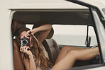 Portrait Beautiful hippie girl taking photos with camera road trip camper van