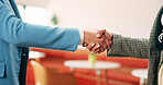 Shaking hands, business people and deal at cafe with success, agreement or hiring with HR manager. Person, human resources and welcome with onboarding, thanks and handshake for support at coffee shop