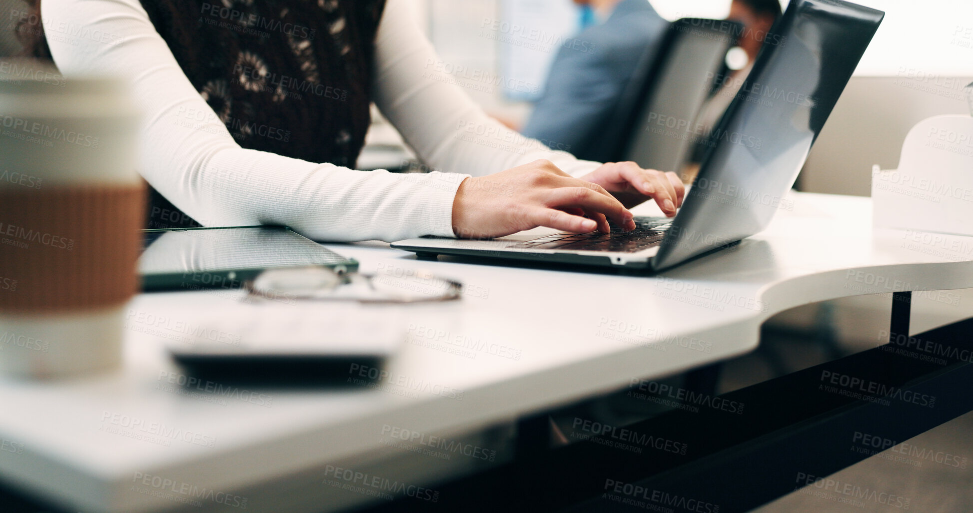 Buy stock photo Hands, laptop and typing with employee woman at desk in office for planning, research or review. Coffee, computer and keyboard with business person in workplace for email feedback, job or report