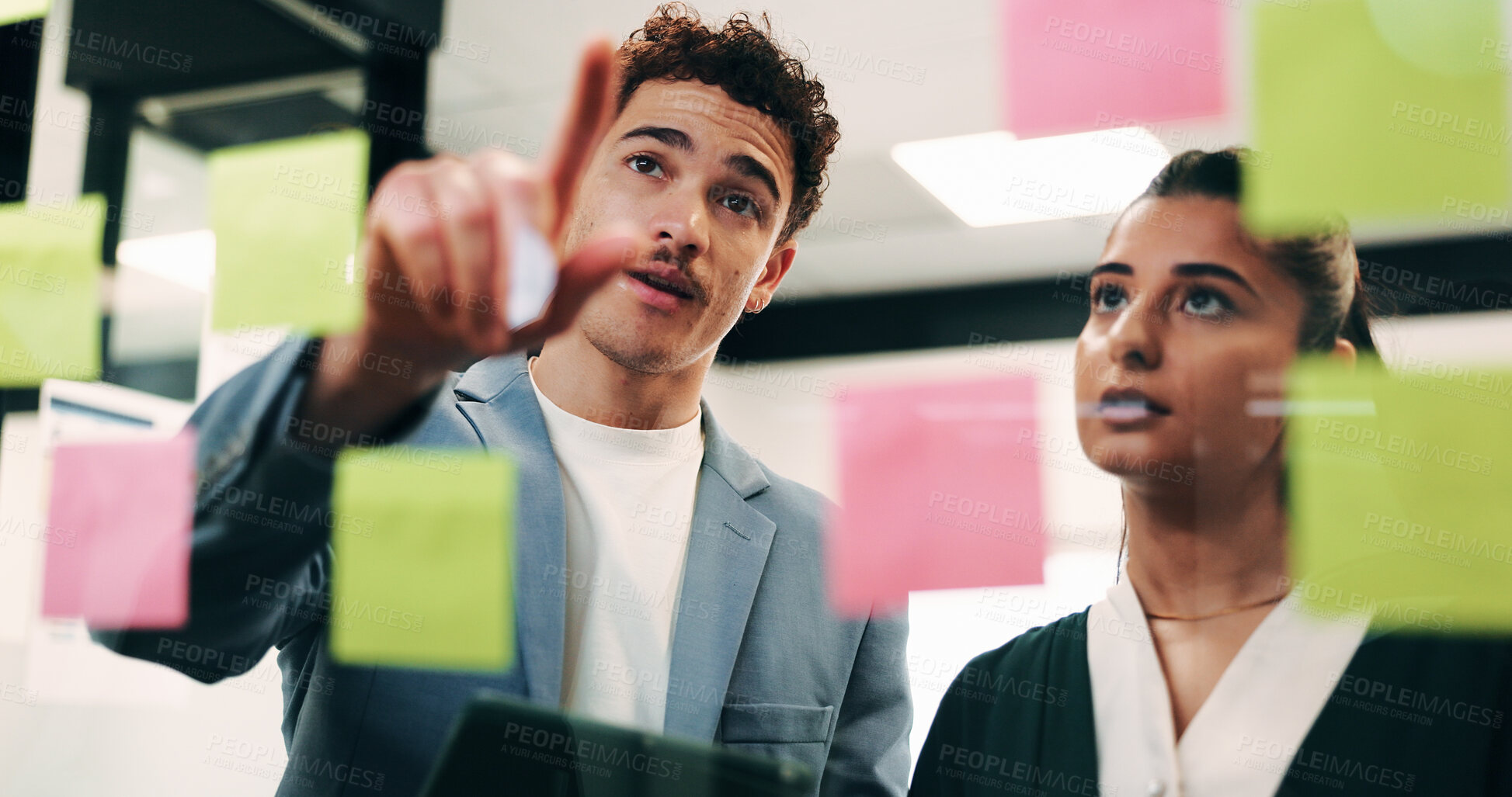 Buy stock photo Man, woman and tablet with planning in office with glass wall, strategy or review finance agency. Business people, broker and team with tech, solution and insight on app at asset management company