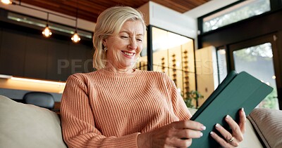 Buy stock photo Reading, ebook and woman with tablet in house, online and chilling with app subscription on weekend. Mature person, home and laughing at funny novel on website, story and literature entertainment