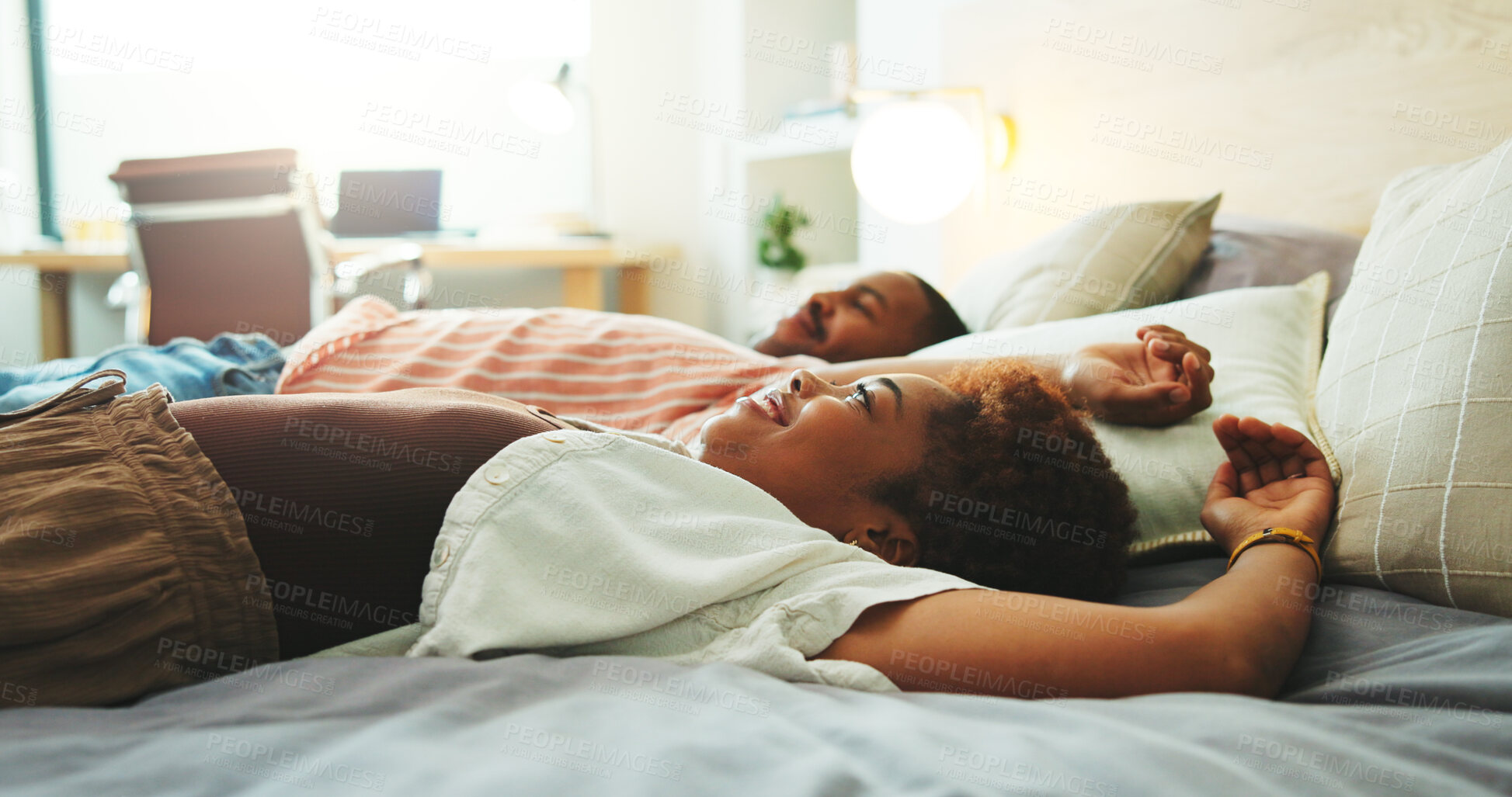 Buy stock photo Happy, relax and couple on bed in hotel for calm, comfort or peaceful morning together on weekend. Smile, hospitality and black man with woman with rest in bedroom at lodge for anniversary holiday.