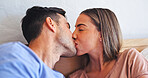 Kiss, love and care with couple in bedroom of home for bonding, support and connection. Trust, romantic partner and affection with man and woman in bed in house for wake up, morning and loyalty 