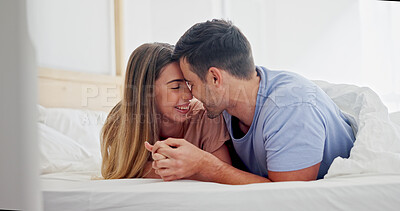 Buy stock photo Holding hands, love and trust with couple in bedroom of home for bonding, support and connection. Relax, romantic partner and happiness with man and woman in bed in house for wellness and loyalty 