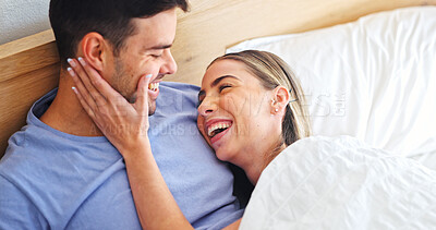 Buy stock photo Joke, love and relax with couple in bedroom of home for bonding, support and connection. Trust, romantic partner and happiness with man and woman in bed in house for wellness, laugh and loyalty 
