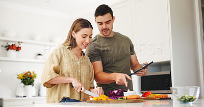 Buy stock photo Tablet, cooking and support with couple in kitchen for food blog, planning lunch and research. Recipe, meal prep app and macro guide with man and woman in home for wellness, connection and menu