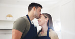 Kiss, kitchen and couple in home with cooking, bonding and connection together in marriage. Happy, love and man with woman for preparing food on date with care, safety and affection in apartment.