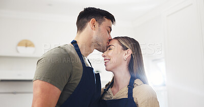 Buy stock photo Kiss, kitchen and couple in home with cooking, bonding and connection together in marriage. Happy, love and man with woman for preparing food on date with care, safety and affection in apartment.