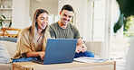 Happy, documents and couple with laptop on sofa in home for discussion on monthly budget for plan. Computer, paperwork and man with woman in conversation for paying bills, mortgage or debt in house.