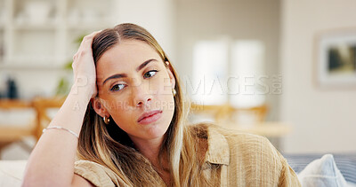 Buy stock photo Sad, thinking and woman in home with anxiety for loneliness, broken heart or mental health challenge. Living room, deep thoughts and person with depression, stress and trauma with regret on sofa
