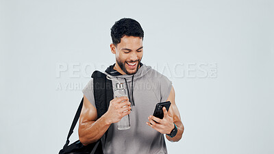 Buy stock photo Happy, fitness and man in studio with phone, health results and exercise progress on mobile app. Space, sports and excited person with water bottle, cellphone and workout stats on white background