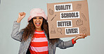 Portrait, woman and protest in studio with billboard, message and quality schools for better lives. Person, attention and fist with cardboard poster, funding and public education on white background
