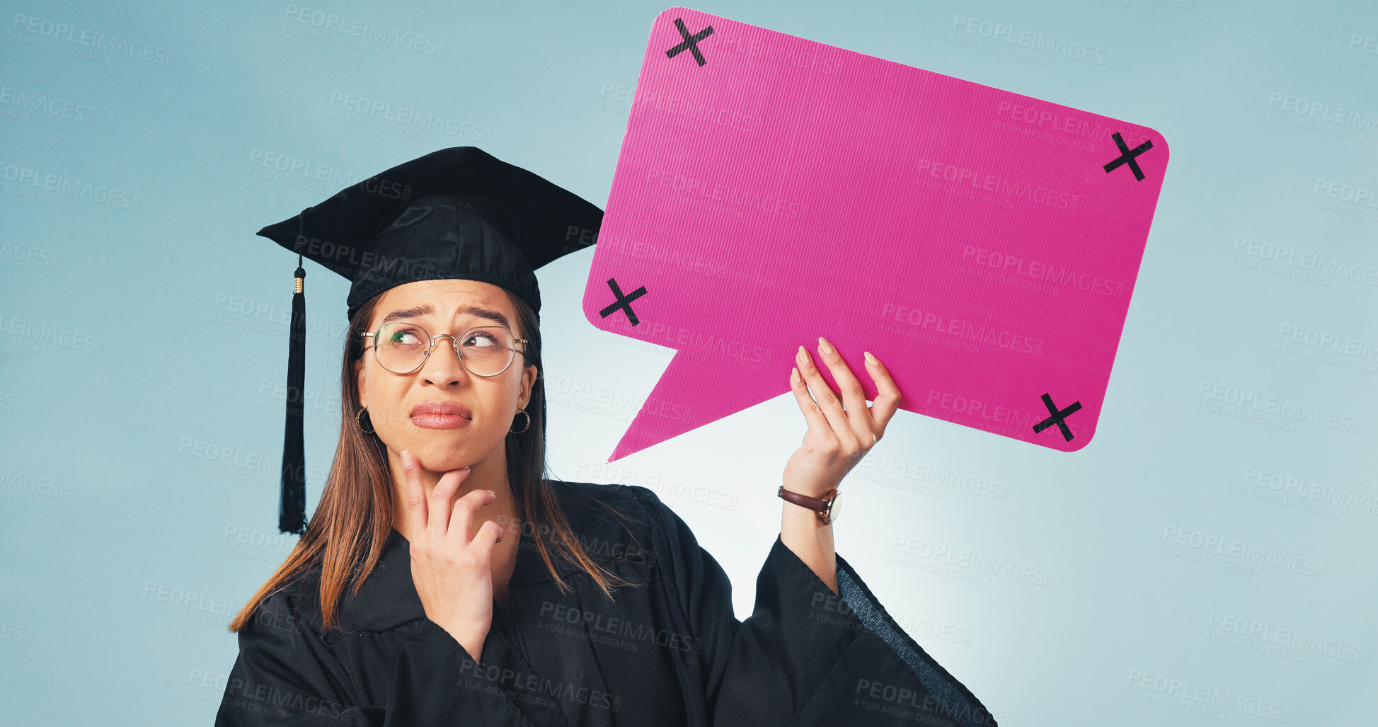 Buy stock photo Graduation, thinking and woman with speech bubble in studio, voice and academic space on social media. Graduate, student and dialogue balloon for education forum, problem solving and blue background