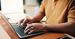 Man, hands and typing with laptop in home for online research, report or journalism on desk. Male person, journalist or writer with computer for network connection, communication or article in house