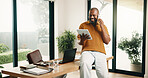 Man, tablet and phone call in home office with remote work, smile and good news for marketing project. Freelancer, black person and contact in apartment with tech, feedback and happy for ad campaign.